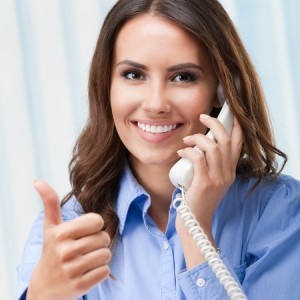 happy smiling  business woman  with thumb up gesture, on phone