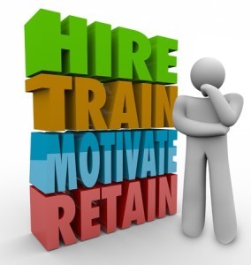 Hire, Train, Motivate and Retain 3d words beside a thinker to illustrate human resources practices to improve employee satisfaction and retention