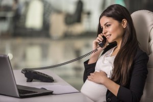 Pregnant Business Woman Working in an Office 