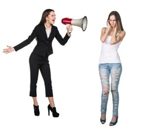 Boss yelling at under-dressed employee through a megaphone