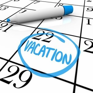 A vacation day is circled on a white calendar with a blue marker