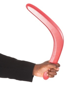 businessman holding a boomerang 