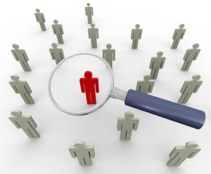 Recruiting and searching for new employees with magnifying glass